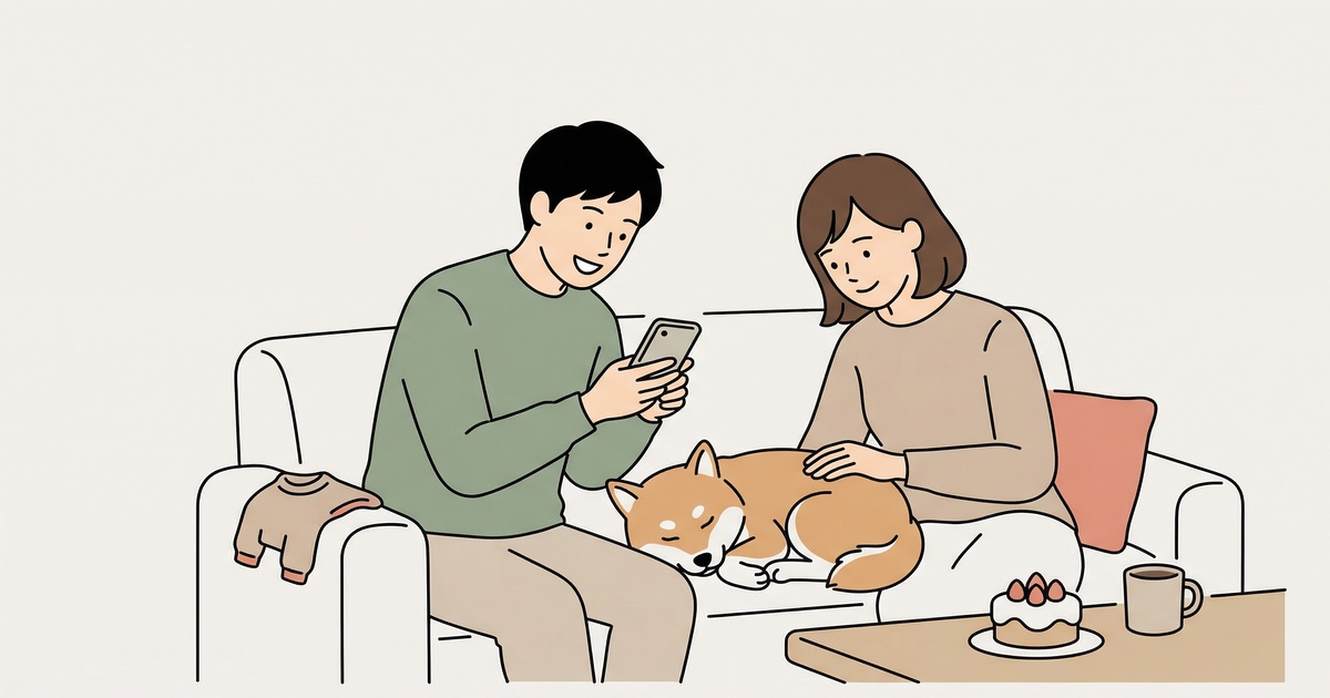 ソファで豆柴の寝顔を覗き込む夫婦